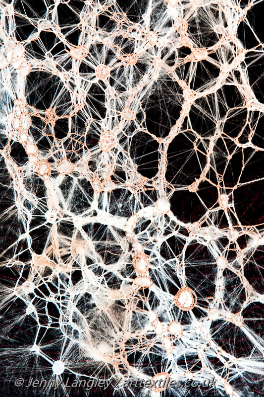 A pulled work sample worked on a silk mawata hankie