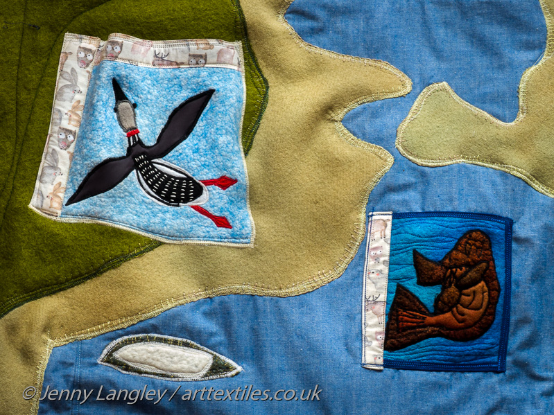 Flying loon and mother walrus and young based on Cape Dorset Inuit art.